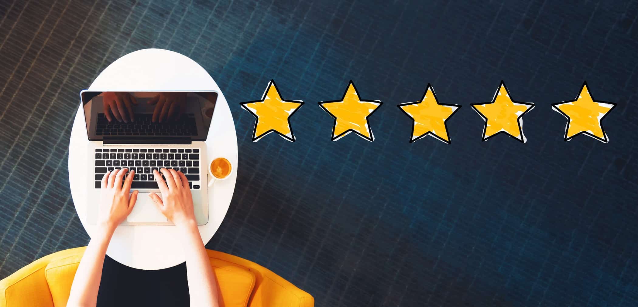 Five Star Rating with person using a laptop on a white table